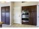 Kitchen featuring stainless steel oven and dark cabinets at 9690 W Martin Rd, Casa Grande, AZ 85194
