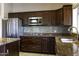 Kitchen features stainless steel appliances, tile backsplash, and granite countertops at 9690 W Martin Rd, Casa Grande, AZ 85194