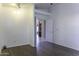 Open-concept living room with light gray walls and tile flooring, perfect for modern living at 9690 W Martin Rd, Casa Grande, AZ 85194