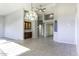 Large living room features tile floors, built in cabinets, and an open concept design at 9690 W Martin Rd, Casa Grande, AZ 85194