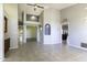 Spacious living room features neutral color palette, tile floors, high ceilings, and an open floor plan at 9690 W Martin Rd, Casa Grande, AZ 85194