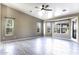 Bright living room featuring tile floors, multiple windows, and a view of the outdoor landscape at 9690 W Martin Rd, Casa Grande, AZ 85194