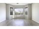 Bright Living Room features a bay window with seating area and wood-look tile floors at 9690 W Martin Rd, Casa Grande, AZ 85194