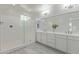 Bright bathroom featuring double sinks with sleek countertops and a glass walk-in shower at 1564 W Redwood Ln, Phoenix, AZ 85045