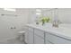 Elegant bathroom featuring double sinks, modern fixtures, and decorative vase at 1564 W Redwood Ln, Phoenix, AZ 85045