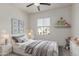 Bright bedroom featuring neutral tones and decor with a bed with decorative pillows at 1564 W Redwood Ln, Phoenix, AZ 85045