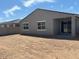 Backyard showcasing a covered patio and fresh dirt for customization at 16084 W Prickly Pear Trl, Surprise, AZ 85387