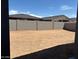 View of backyard showcasing privacy wall and dirt ready for personalization at 16084 W Prickly Pear Trl, Surprise, AZ 85387