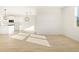 Bright living area with modern wood-style flooring, providing a welcoming and airy space at 16084 W Prickly Pear Trl, Surprise, AZ 85387