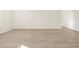 Spacious living room with neutral walls and flooring, providing a blank canvas for personalization at 16084 W Prickly Pear Trl, Surprise, AZ 85387