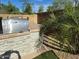Outdoor grill area featuring a stone finish and lush greenery, perfect for outdoor cooking and entertaining at 2050 W Davis Rd, Phoenix, AZ 85023