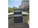 Built-in BBQ island with stone accents and modern grill, creating a functional outdoor cooking area at 2050 W Davis Rd, Phoenix, AZ 85023