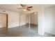 Bedroom with ceiling fan, tile floor, and closet with mirrored sliding doors at 7960 E Camelback Rd # 110, Scottsdale, AZ 85251