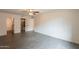 Bright bedroom with tile floors, ceiling fan, and access to bathroom at 7960 E Camelback Rd # 110, Scottsdale, AZ 85251