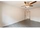 Empty bedroom with ceiling fan and tile flooring at 7960 E Camelback Rd # 110, Scottsdale, AZ 85251