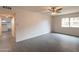 Bedroom with a window view, ceiling fan and access to a kitchen area at 7960 E Camelback Rd # 110, Scottsdale, AZ 85251