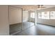 Bedroom with mirrored sliding closet doors, ceiling fan, and tiled floor at 7960 E Camelback Rd # 110, Scottsdale, AZ 85251
