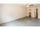 Bright bedroom showcasing tile floors and access to closet and bathroom at 7960 E Camelback Rd # 110, Scottsdale, AZ 85251