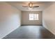 Empty bedroom with a window view, ceiling fan, and tile floor at 7960 E Camelback Rd # 110, Scottsdale, AZ 85251