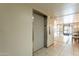 Hallway featuring an elevator in a condo building with tile floors and neutral wall color at 7960 E Camelback Rd # 110, Scottsdale, AZ 85251