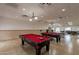 Spacious game room with two pool tables and ping pong with well-lit recreational space at 7960 E Camelback Rd # 110, Scottsdale, AZ 85251
