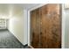 Hallway with unit doors and neutral carpet at 7960 E Camelback Rd # 110, Scottsdale, AZ 85251