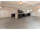 Bright kitchen with large island, modern lighting, stainless steel appliances, and stylish gray tile flooring at 7960 E Camelback Rd # 110, Scottsdale, AZ 85251