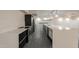 Modern kitchen with white countertops, stainless steel appliances, and stylish gray tile flooring at 7960 E Camelback Rd # 110, Scottsdale, AZ 85251