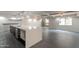 Modern kitchen island with sleek countertops, faucet, gray tile flooring, with access to a charming balcony at 7960 E Camelback Rd # 110, Scottsdale, AZ 85251