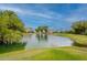 A view of a pond on the golf course with a fountain in the center at 7960 E Camelback Rd # 110, Scottsdale, AZ 85251