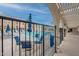 Community pool area with lounge chairs, umbrellas, tables, and sunny pool views at 7960 E Camelback Rd # 110, Scottsdale, AZ 85251
