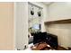 Modern home office setup with hanging plants, offering a glimpse into a relaxing living space at 9760 E Thatcher Ave, Mesa, AZ 85212