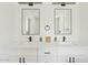 Modern bathroom with dual sinks, updated fixtures, and framed mirrors at 10832 N 37Th St, Phoenix, AZ 85028