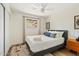 Cozy bedroom featuring a comfortable bed, white ceiling fan, and modern decor at 10832 N 37Th St, Phoenix, AZ 85028