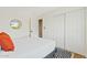 Bedroom featuring a comfortable bed, convenient closet space, and modern accents at 10832 N 37Th St, Phoenix, AZ 85028