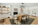 Charming dining room with a fireplace, open shelving, and a stylish dining table at 10832 N 37Th St, Phoenix, AZ 85028