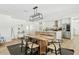 Open concept kitchen and dining area with modern appliances and a cozy seating arrangement at 10832 N 37Th St, Phoenix, AZ 85028
