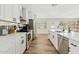 Modern kitchen with white cabinets, stainless steel appliances, and a spacious island at 10832 N 37Th St, Phoenix, AZ 85028