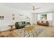 Inviting living room featuring modern decor, wood floors, and a cozy seating arrangement at 10832 N 37Th St, Phoenix, AZ 85028
