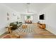 Bright living room with a ceiling fan, wood floors, and stylish furnishings at 10832 N 37Th St, Phoenix, AZ 85028