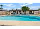 Backyard pool and patio area with ample seating and a covered dining space at 10832 N 37Th St, Phoenix, AZ 85028