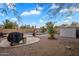 Spacious backyard with desert landscaping, a swimming pool, and an outdoor barbecue grill at 1123 N Agave St, Casa Grande, AZ 85122
