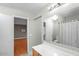 Bright bathroom adjacent to the bedroom with a tub and shower combo at 1123 N Agave St, Casa Grande, AZ 85122