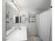 Clean bathroom with a tub and shower combo, complete with decorative finishes at 1123 N Agave St, Casa Grande, AZ 85122