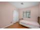 Cozy bedroom featuring a twin bed, closet, and a window at 1123 N Agave St, Casa Grande, AZ 85122