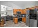 Modern kitchen with stainless steel appliances, granite countertops, and wooden cabinetry at 1123 N Agave St, Casa Grande, AZ 85122