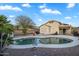 Inviting backyard pool surrounded by desert landscaping, perfect for relaxing and entertaining at 1123 N Agave St, Casa Grande, AZ 85122