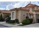 Attractive single-story home with a terracotta roof and landscaped front yard, and a dark SUV parked in the driveway at 11390 N 78Th St, Scottsdale, AZ 85260