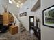 Open hallway with staircase, home office, and neutral tones with framed art throughout at 11390 N 78Th St, Scottsdale, AZ 85260