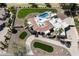 An aerial view showcasing the layout of the home, pool, expansive yard and landscaping at 11416 N Blackheath Rd, Scottsdale, AZ 85254